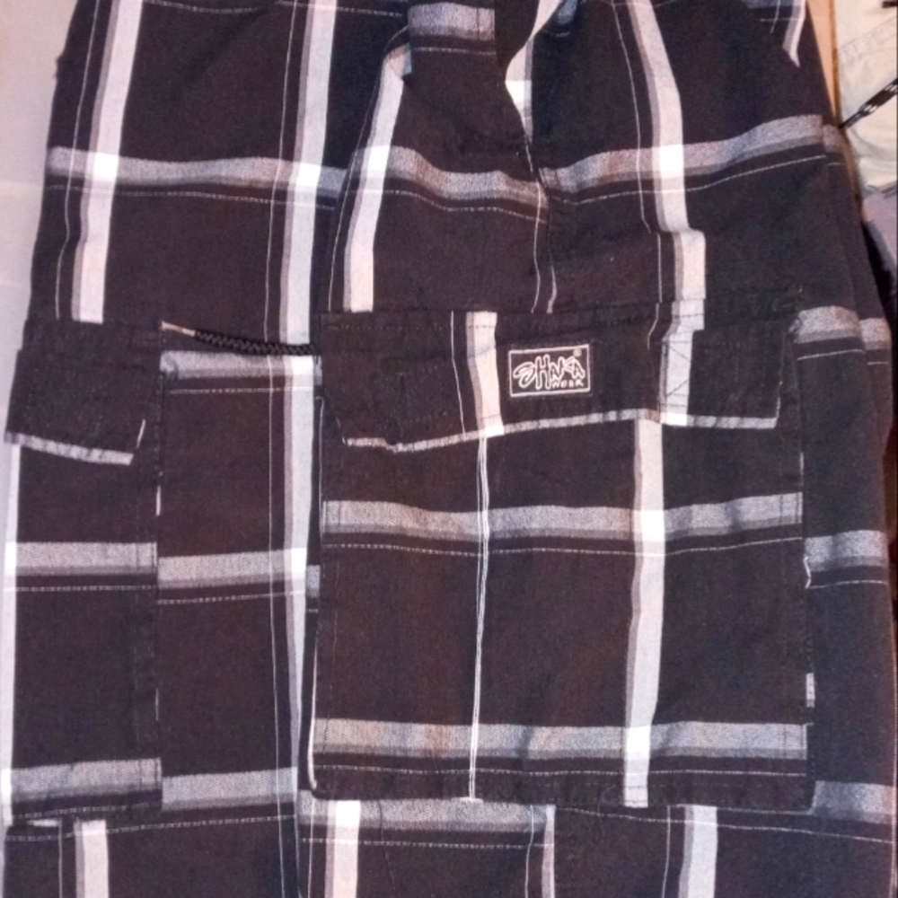 Shaka wear black and white plaid shorts. Hardly worn. Men's medium